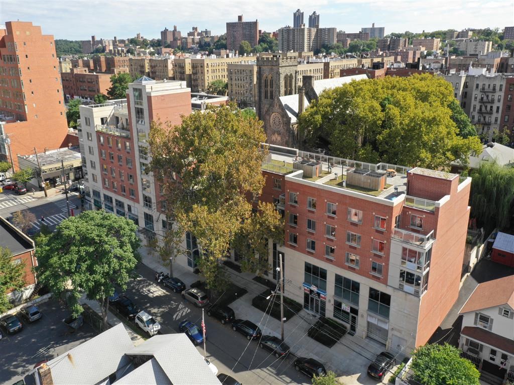 an aerial view of a city with buildings and trees