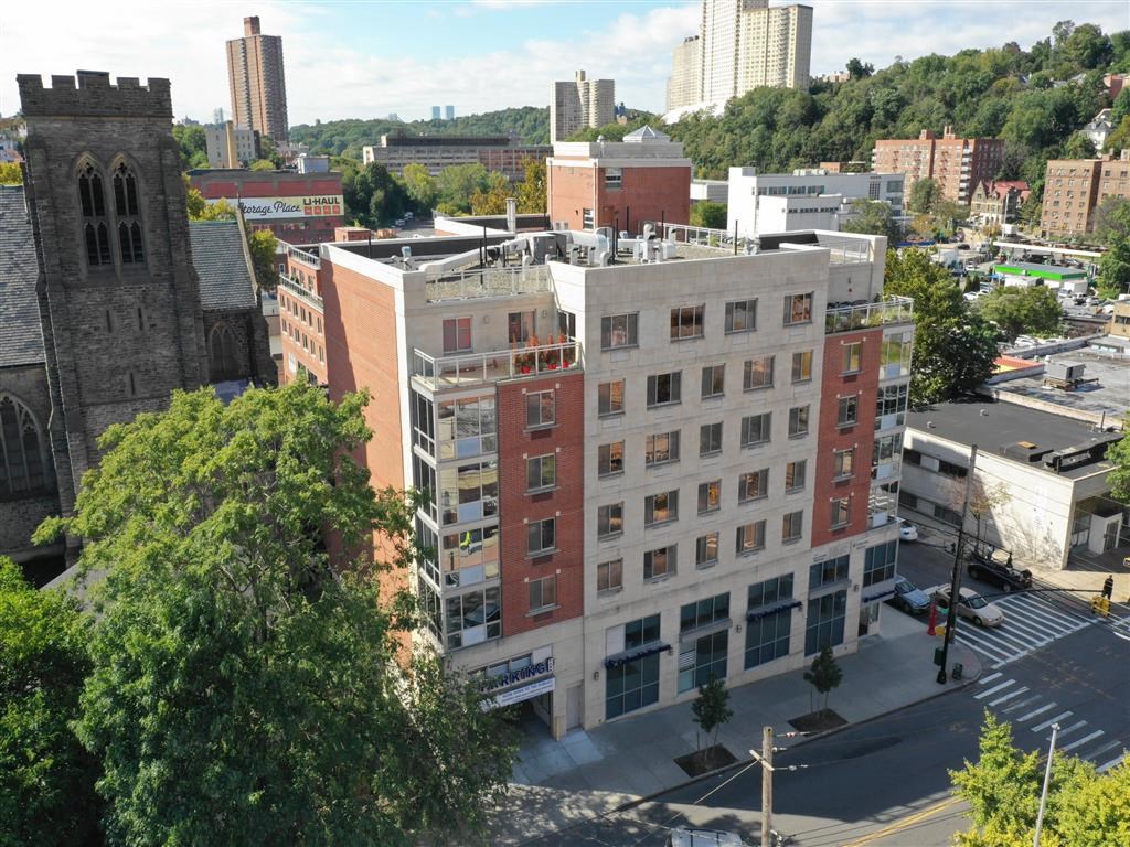 an aerial view of a building in the city