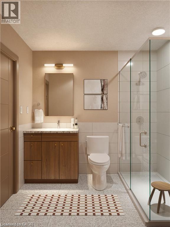 A bathroom with a toilet, sink, and shower.