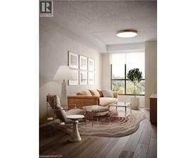 A modern living room with a sofa, chair, and lamp.