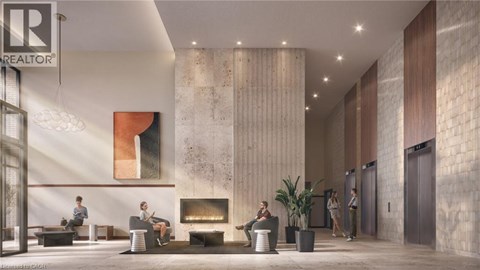 A lobby with a fireplace and people sitting.