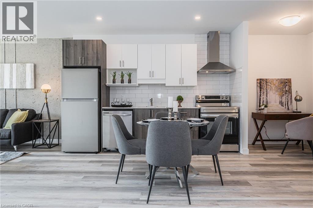 A modern kitchen with a dining table set for four.
