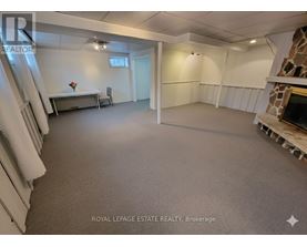 A spacious room with a table and chairs is available for rent.