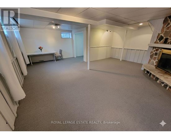 A spacious room with a table and chairs is available for rent.