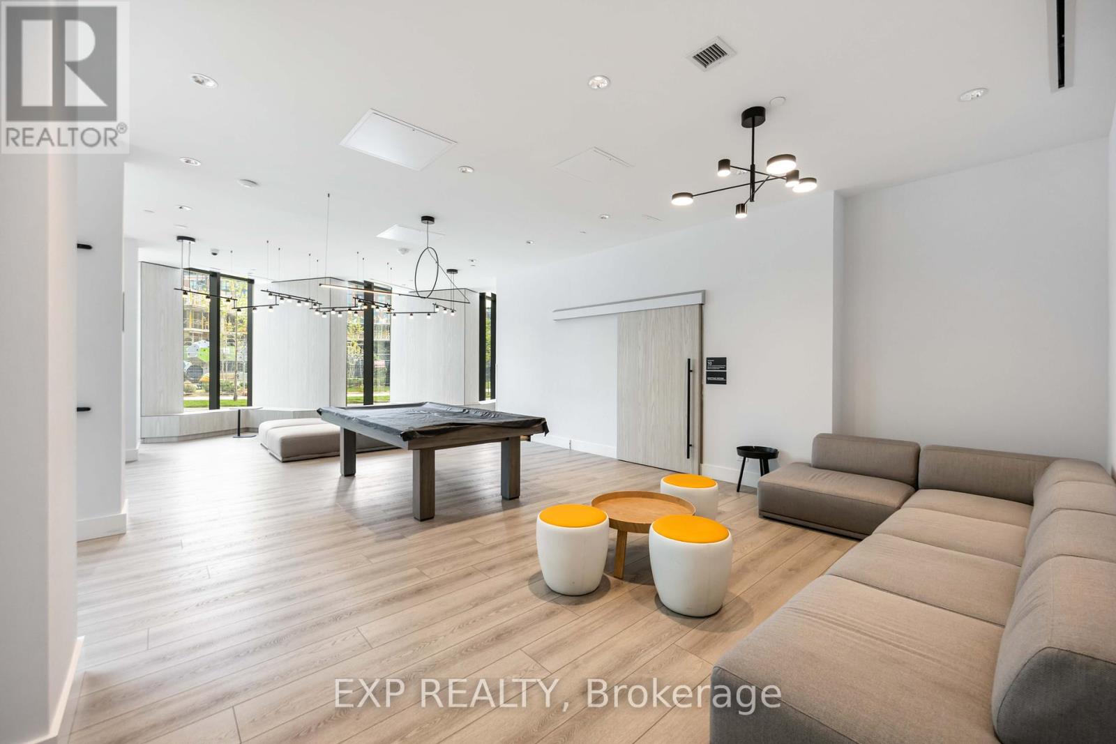 A modern living room with a large couch and a coffee table.