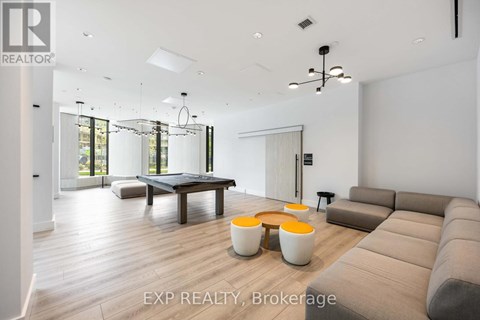 A modern living room with a large couch and a coffee table.