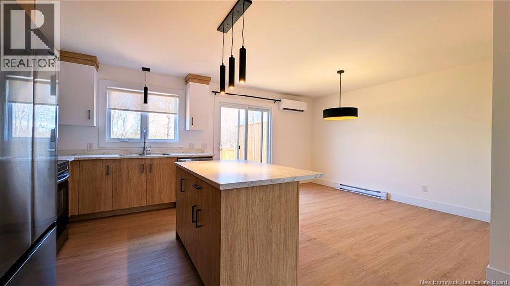 A kitchen with wooden cabinets and a countertop is shown.