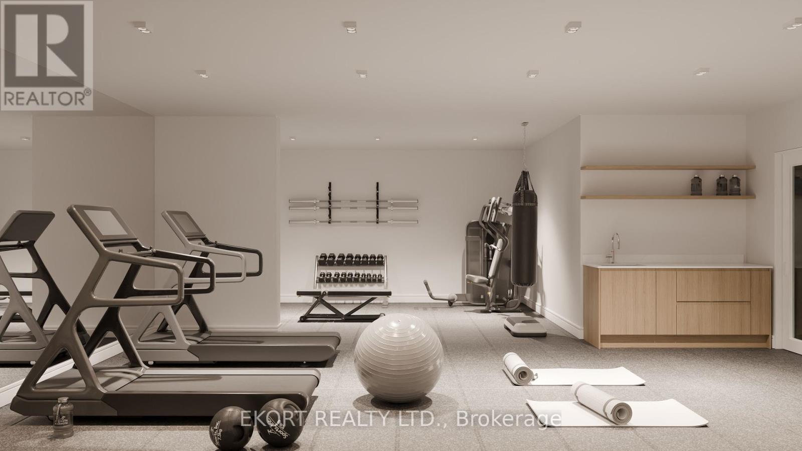 A gym with a variety of equipment including a treadmill, weights, and a yoga mat.
