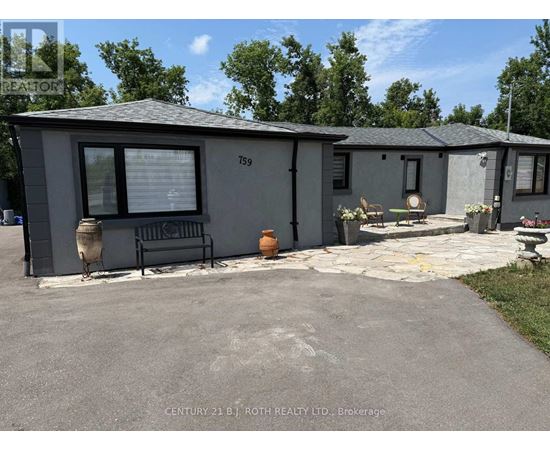 A grey house with the number 159 on it.