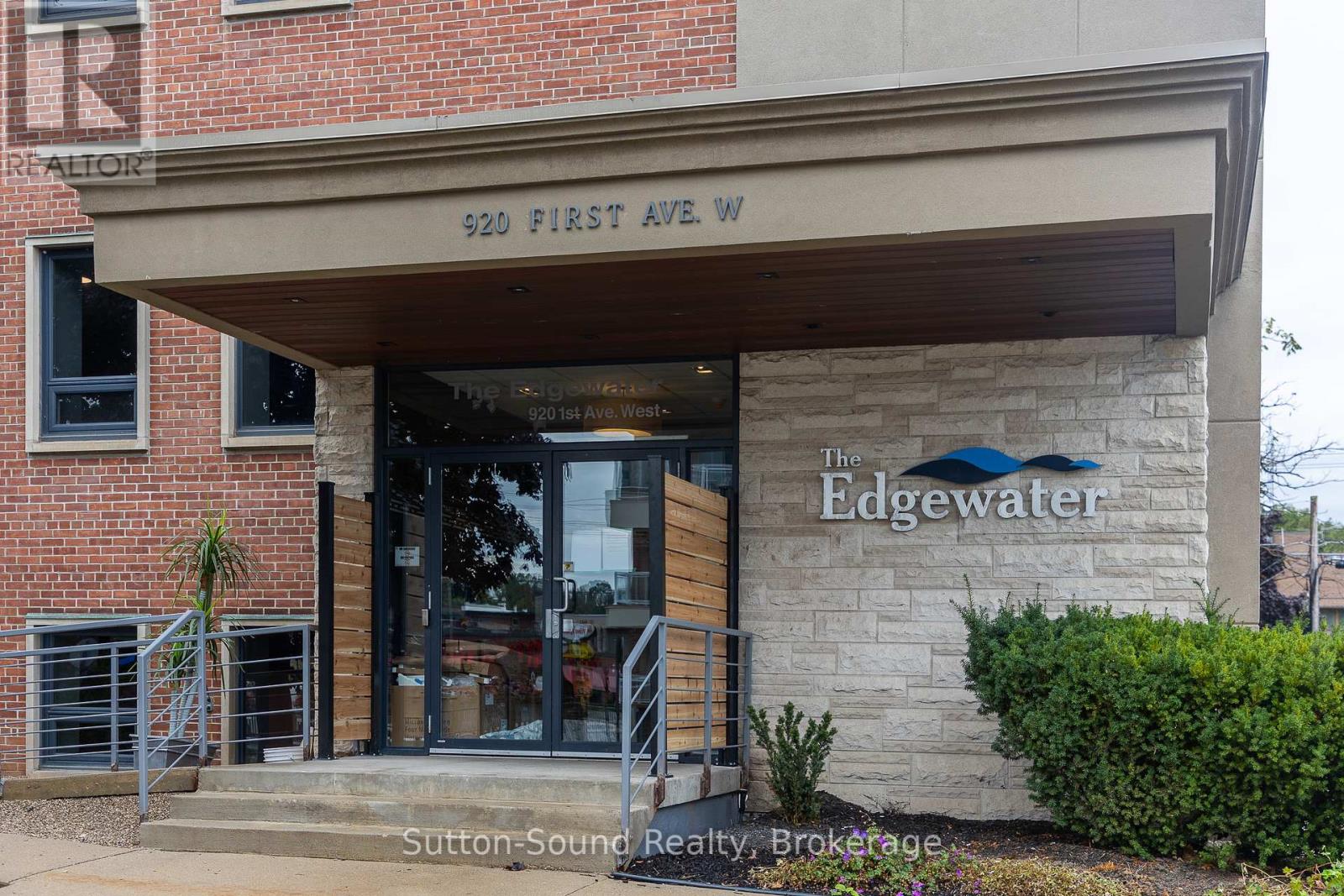 The entrance to a building with a sign that reads "The Edgewater."