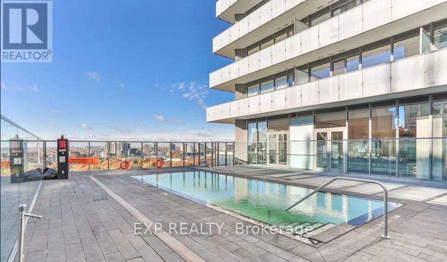 A pool on a balcony of a building with the words EXP REALTY Brokerage on the bottom.