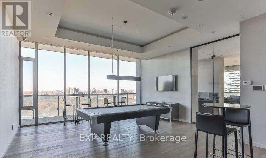 A modern dining room with a pool view.