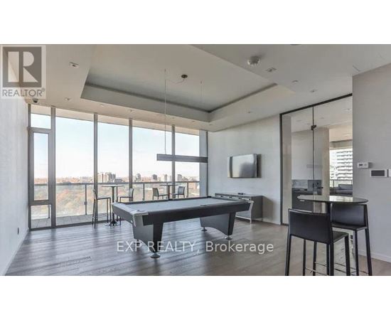 A modern dining room with a pool view.
