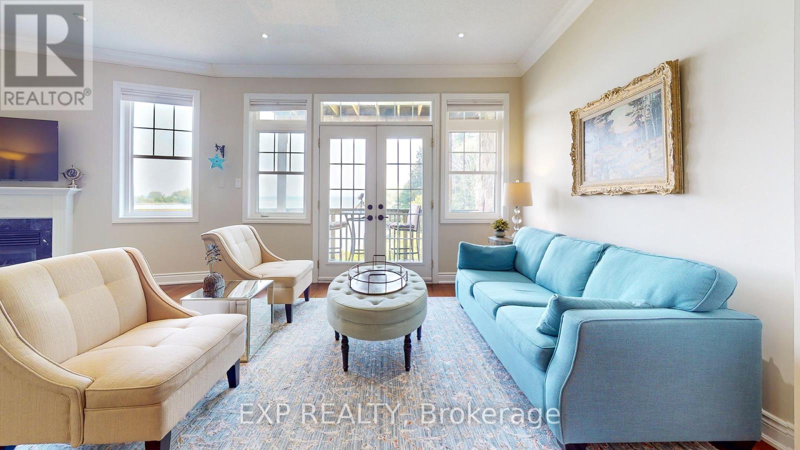 A living room with a blue couch and a coffee table.