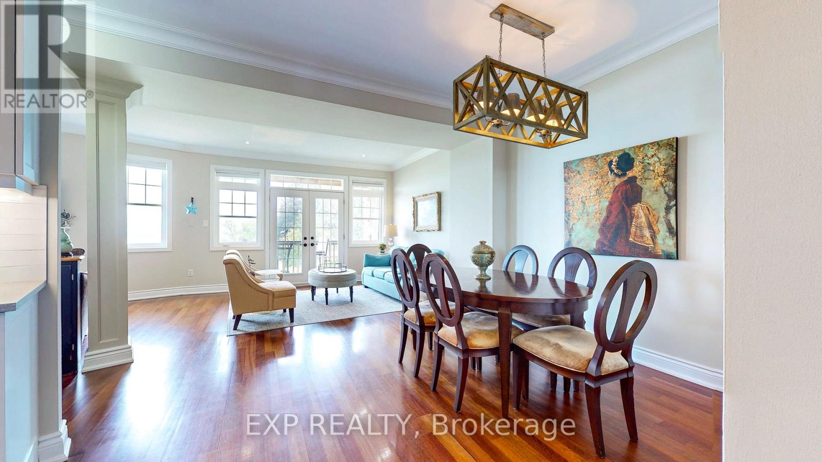 A dining room with a wooden table and chairs.