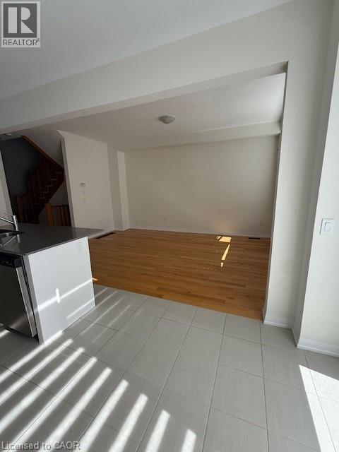 A room with a wooden floor and white walls.