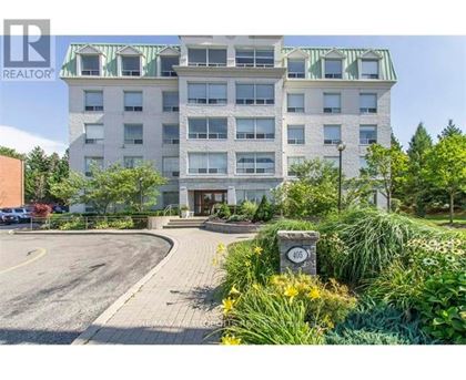 A building with a green roof and a sign that says REALTOR.