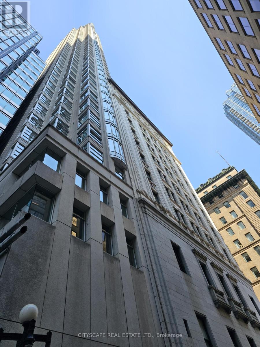 A tall building with the words "Cityscape Real Estate Ltd." on the side.