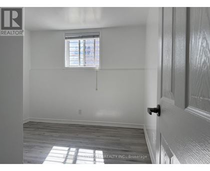 A room with a window and a door.