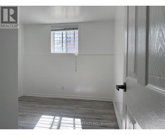A room with a window and a door.
