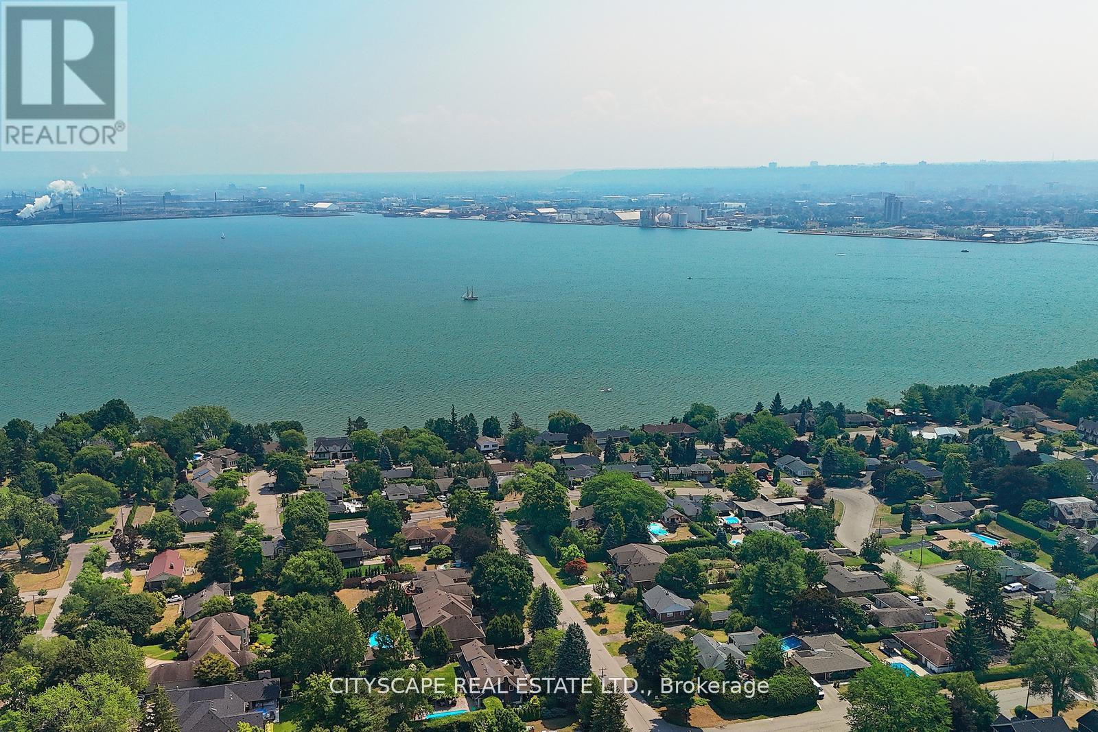 A bird's eye view of a residential area with houses and trees.