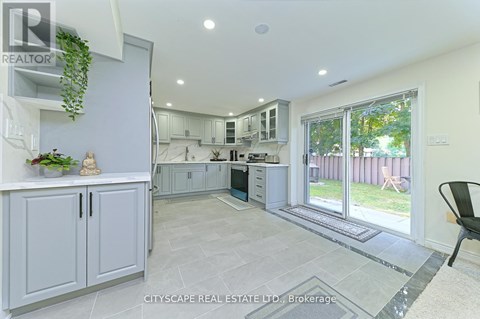 A real estate listing image of a kitchen and dining area.
