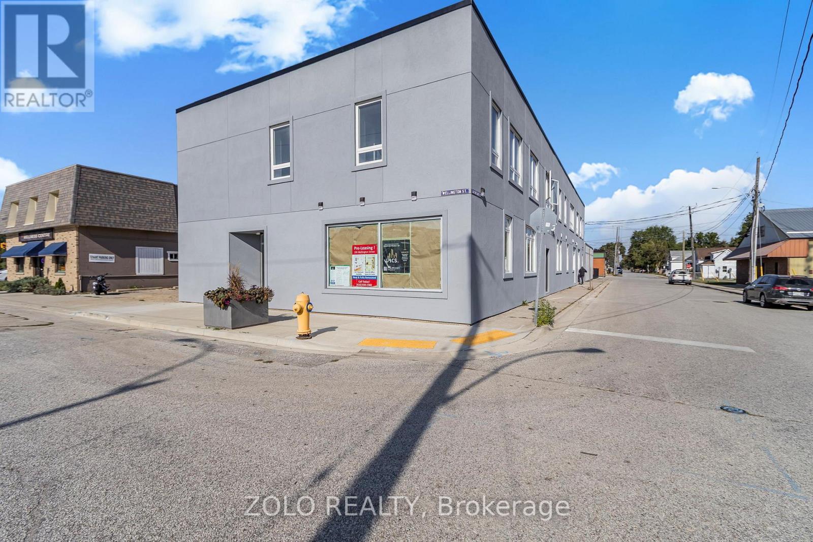 A building with a sign that says ZOLO REALTY Brokerage.