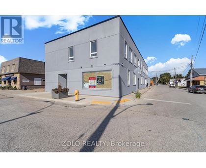 A building with a sign that says ZOLO REALTY Brokerage.