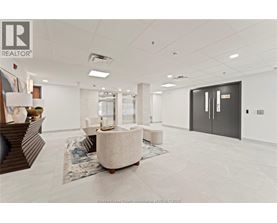 A spacious office room with a large table and chairs.