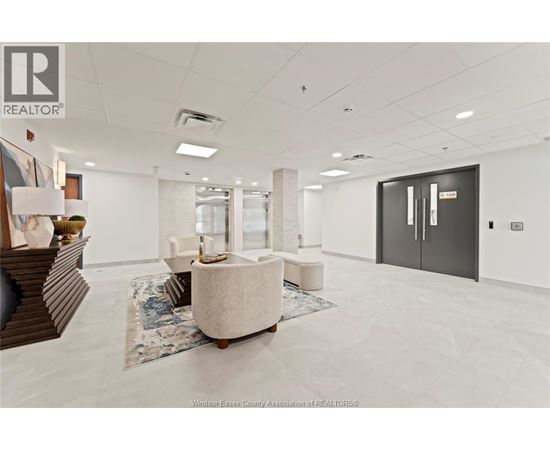 A spacious office room with a large table and chairs.