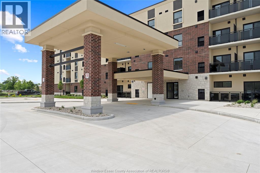A large building with a covered walkway in front.