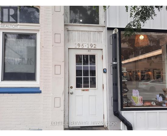 A white door with a glass window and a black handle.