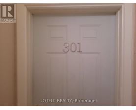 A white door with the number 301 on it.