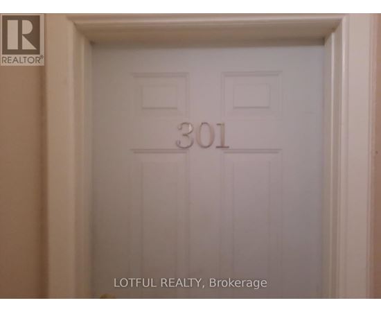 A white door with the number 301 on it.