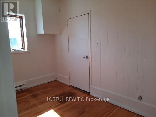 A room with a door and a window.