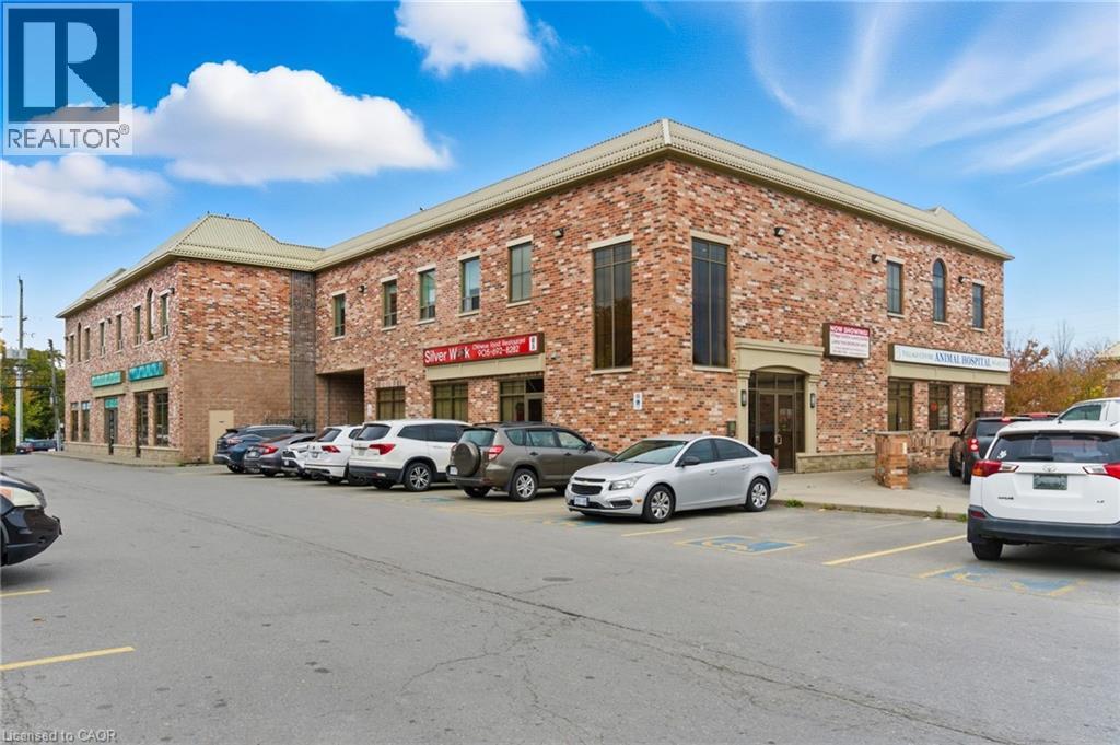 A building with a parking lot in front of it.
