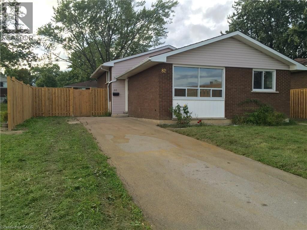 A house numbered 86 with a white door and windows.