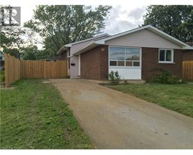 A house numbered 86 with a white door and windows.