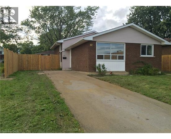 A house numbered 86 with a white door and windows.