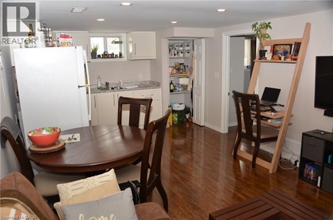 A kitchen with a table and chairs in the middle of the room.