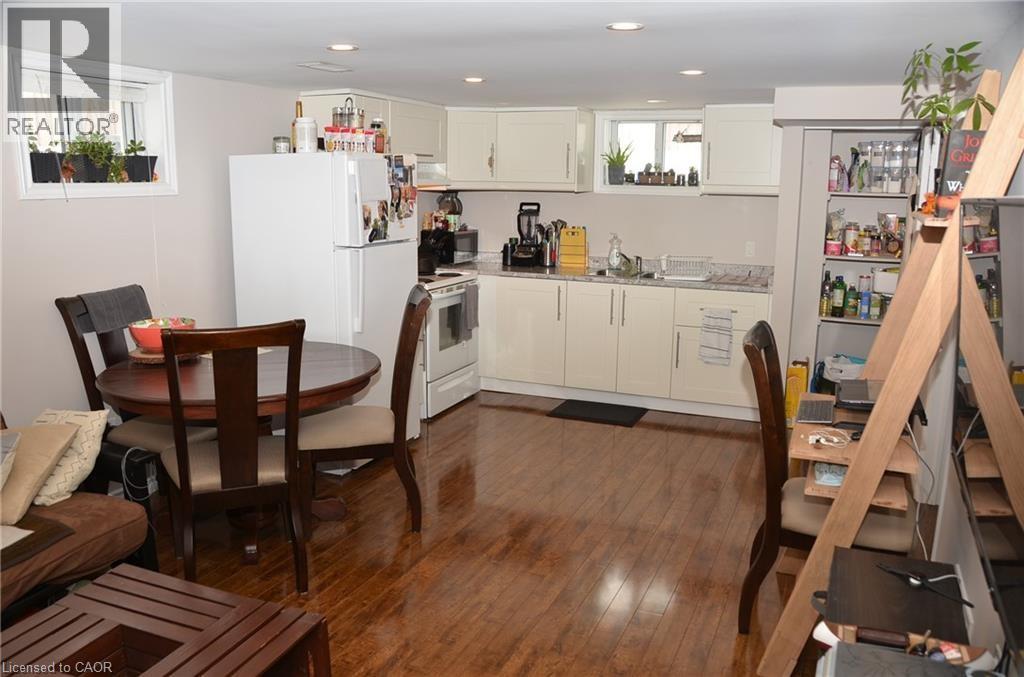 A kitchen with a table and chairs in the middle of the room.