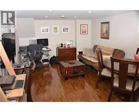 A living room with a couch, chair, and coffee table.