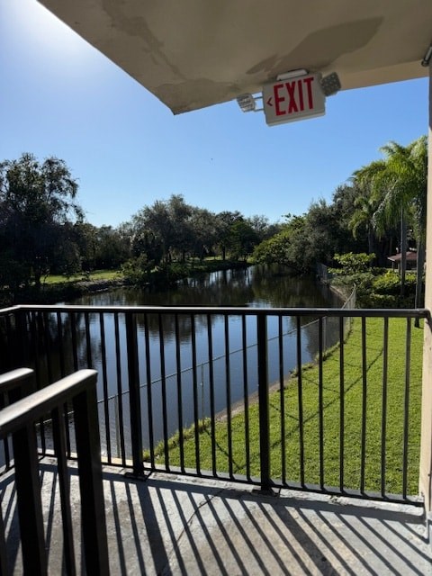 A view from a balcony with an exit sign above it.