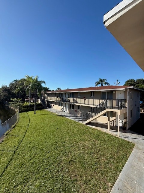 A building with a green lawn in front of it.