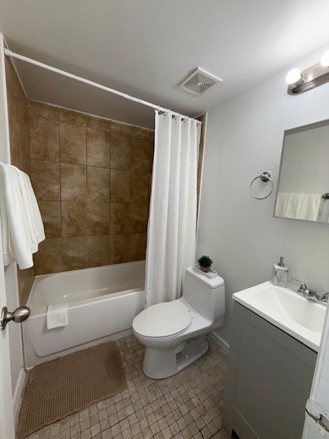 A small bathroom with a toilet, sink, and bathtub.