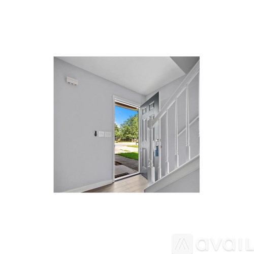 A white door with a window above it.