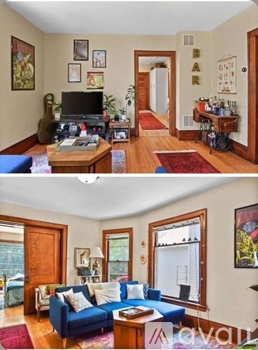 A living room with a blue couch and a television.