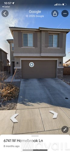 A house with a garage door is located at 6741 W Homebrook Lane.