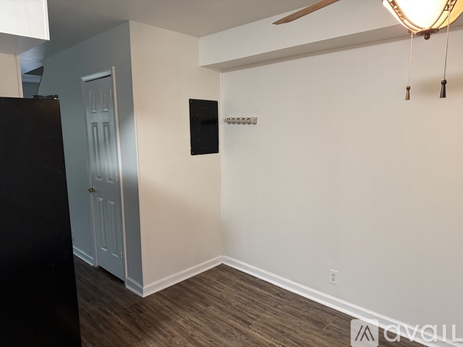 A room with a black door and a white door.