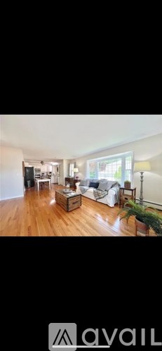 A living room with a couch and a coffee table.